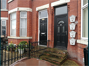 houses with various letterboxes outside